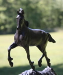 Horse sculpture of young friesian horse