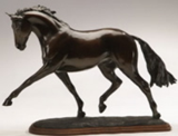 Horse sculpture of dressage horse performing extended trot